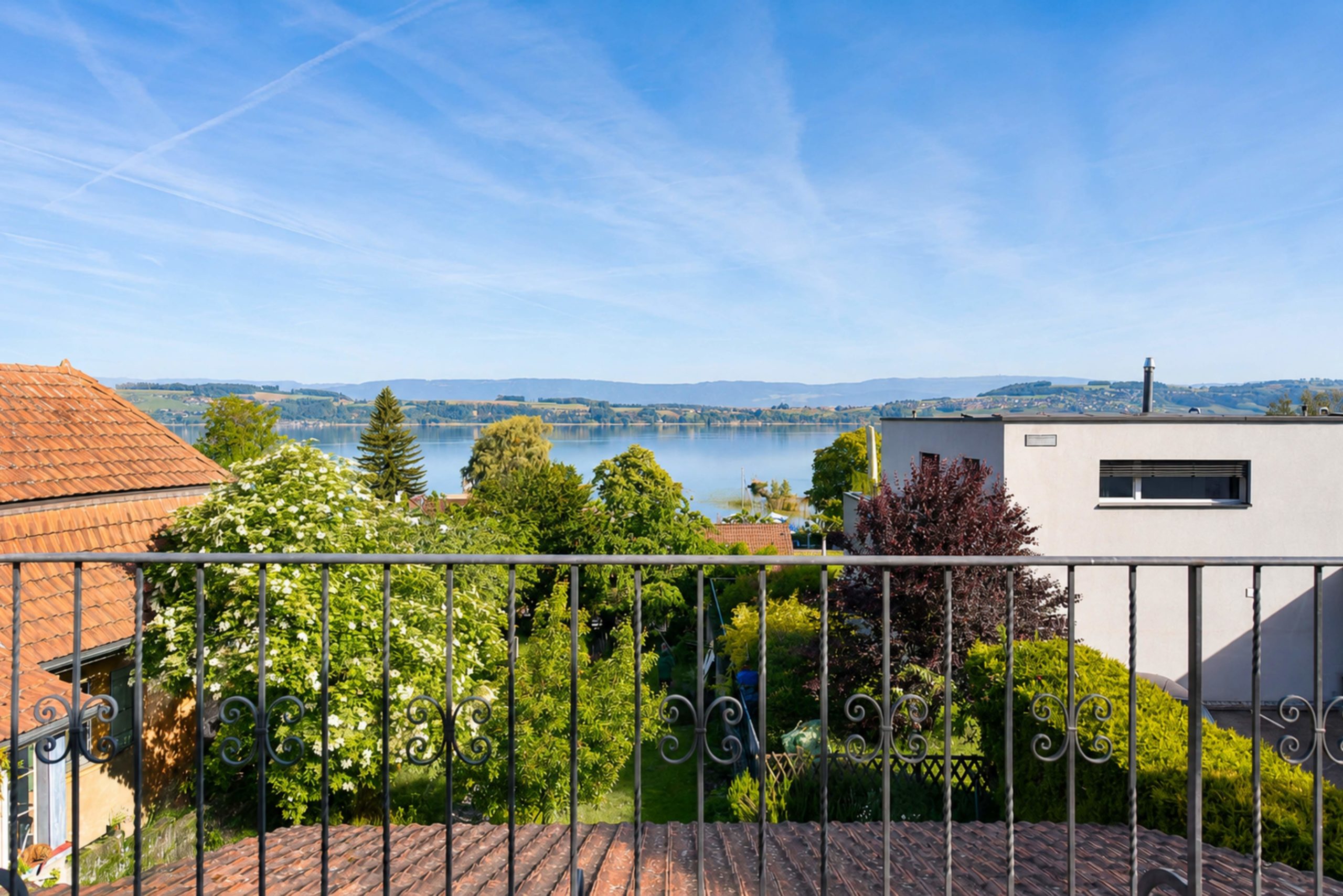 Appartement de 4.5 pièces avec terrasse, jardin privatif et vue sur le lac - Photo de présentation